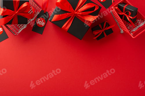 Preview: Savings Season Delight: Top view image of black gift boxes featuring red ribbon bows