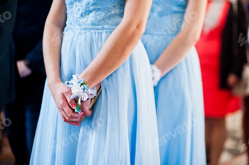Preview: Hands of bridesmaids on blue dresses at wedding.