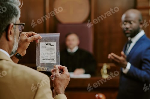 Preview: Middle Aged Caucasian Man Presenting Evidence Bag during Courtroom Trial