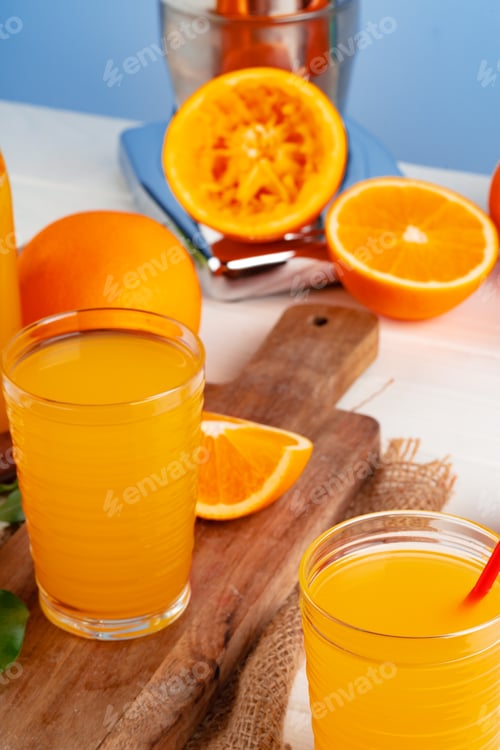 Preview: Orange juice cup on table close up