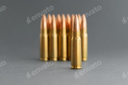 Preview: Bullets on gray background. Cartridges 7.62 caliber for Kalashnikov assault rifle