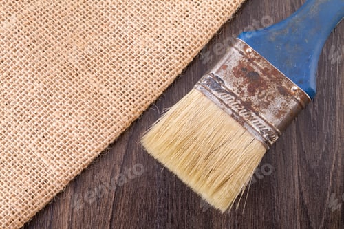 Preview: sackcloth and old brush on the wooden table