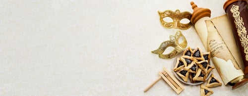 Preview: Purim Celebrations. Golden mask, scroll, gragger, and hamantaschen on decorative background