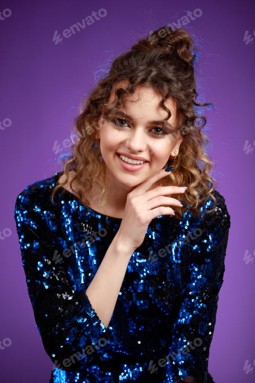 Preview: Close-up photo of curly-haired girl smiling to the camera