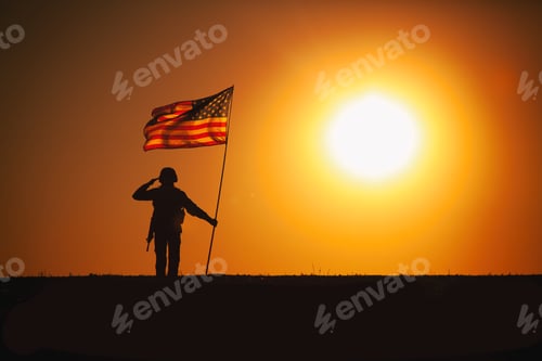 Preview: USA Soldier with flag saluting on sunset horizon