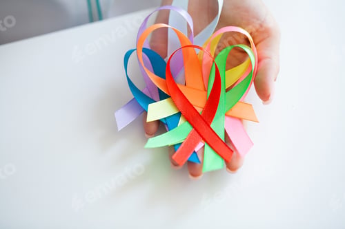 Preview: Female doctor holds colored ribbons symbolize awareness of various diseases
