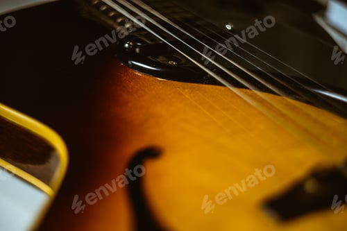 Preview: Closeup shot of a wooden guitar on the table