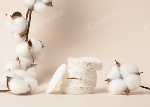 Preview: White cotton sponges on beige background. Design for the beauty, medicine and cosmetics industry
