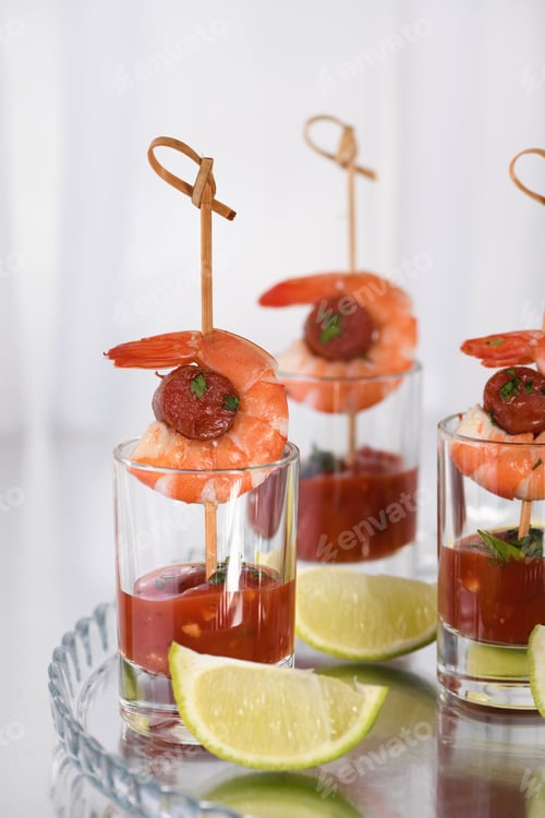 Preview: Shrimp and Sausage Appetizers with Lime Wedges