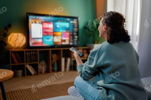 Preview: woman watching TV at home