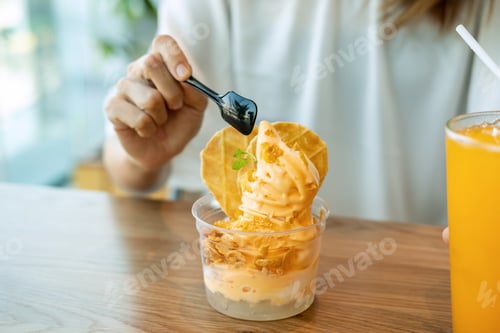 Preview: Young asian woman enjoy eating dessert in restaurant