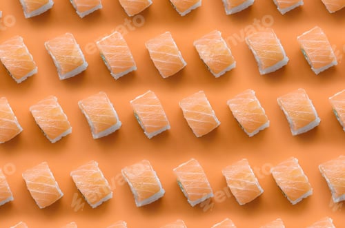 Preview: Philadelphia rolls with salmon on orange background. Minimalism top view flat lay pattern