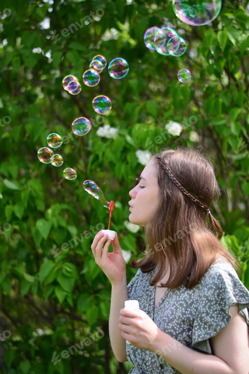 Preview: Girl blowing bubbles