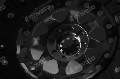 Preview: Close-up picture of a part of car, black clutch disk isolated on black background