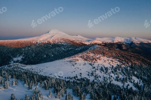 Preview: Winter aerial landscape of majestic Carpathian mountains. Background with sunset