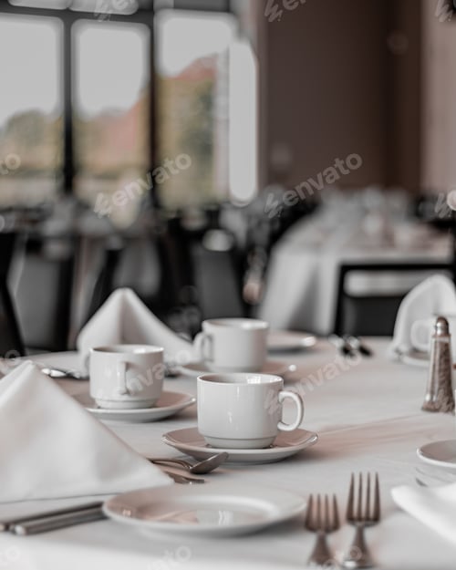 Preview: Vertical shot of neat tables in a nice, empty and clean restaurant