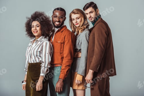 Preview: smiling multicultural retro styled friends standing isolated on grey
