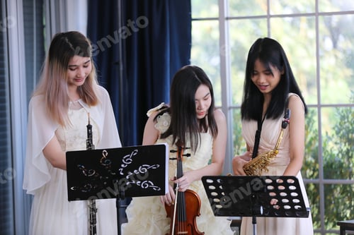 Preview: classic musical song student are learning to play a music instrument in sound studio musician class