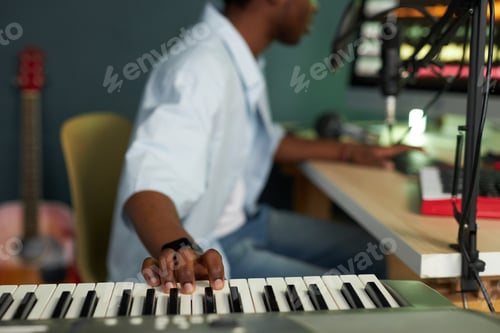 Preview: Producer Playing Synthesizer In Studio