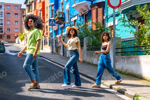 Preview: Group of stylish friends walking down a colorful street