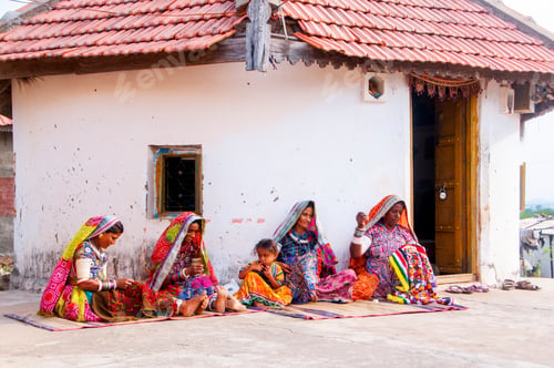Preview: Tribal woman working her traditional handicrafts by embroidering colorful thread., india