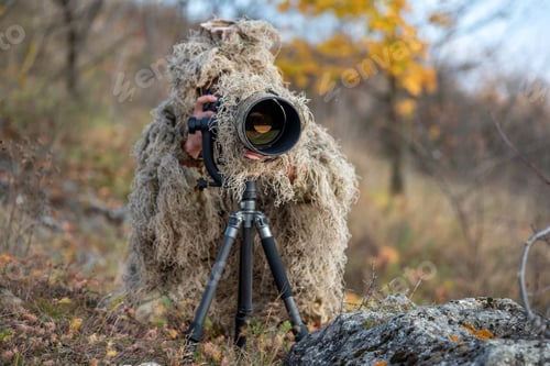 Preview: Wildlife photographer in the ghillie suit working