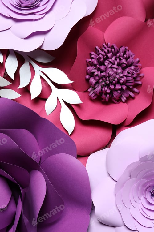 Preview: Different beautiful flowers and branches made of paper as background, top view