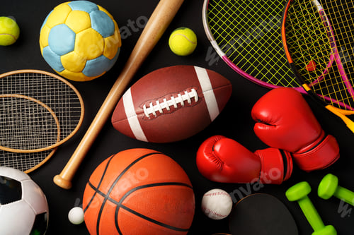 Preview: Various sports equipment on black background studio shot