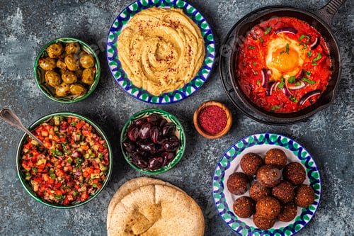 Preview: Falafel, hummus, shakshuka, Israeli salad - traditional dishes of Israeli cuisine.