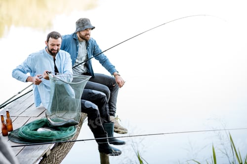 Preview: Fishermen with fish on the lake