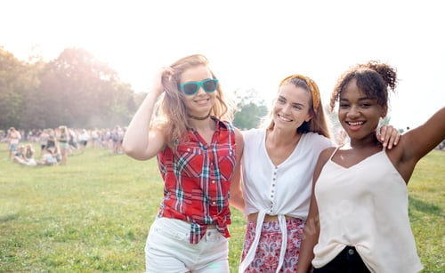 Preview: Girls having fun outdoor during summer music festival