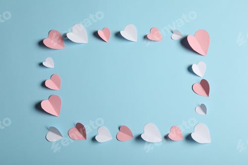Preview: Frame of many paper hearts on light blue background, flat lay. Space for text