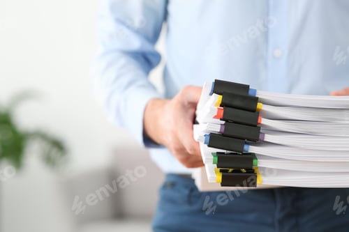 Preview: Businessman with documents in office, closeup. Space for text
