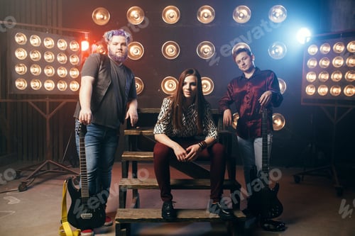 Preview: Musical group poses on the stage in night club