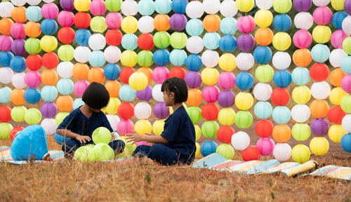 Preview: Childhood life in rural Thailand. A small child plays with colorful little hanging lamp