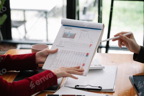 Preview: Business People Meeting to analyse and discuss and brainstorming the financial report chart data in