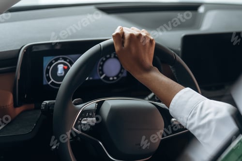 Preview: Woman in white shirt is in the modern car