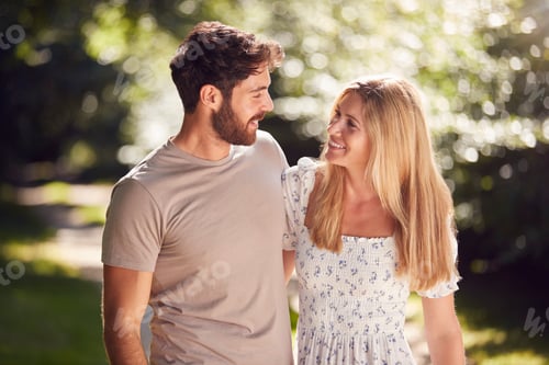 Preview: Loving Couple Walking Along Countryside Path In Summer Together