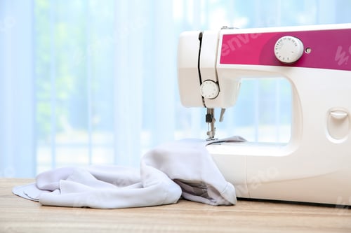 Preview: Sewing machine on table near window indoors
