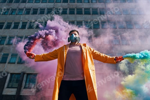 Preview: Young man in respirator mask hold smoke bombs in raised hands