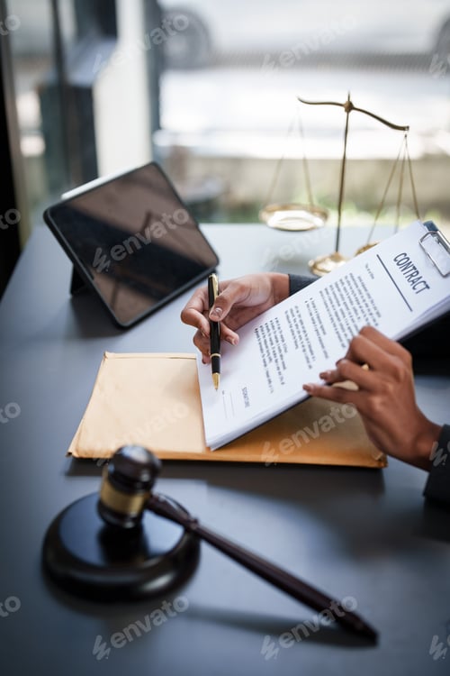 Preview: Lawyer working at office. Asian Lawyer doing with contract or document in office. Law, legal