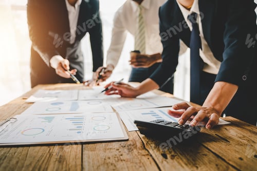 Preview: Young colleagues discussing business and price chart analyzes business people on the table great in
