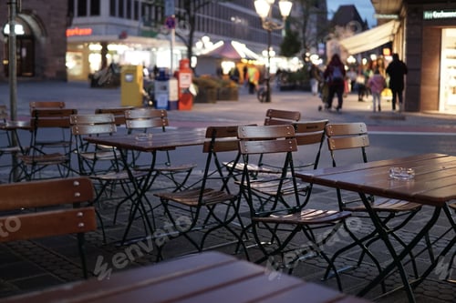 Preview: Close up shot of the wooden tables and chairs in the outside area of a cafeteria