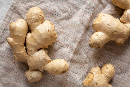 Preview: Raw Organic Ginger Root on cloth, top view. Flat lay, from above, overhead. Close-up.