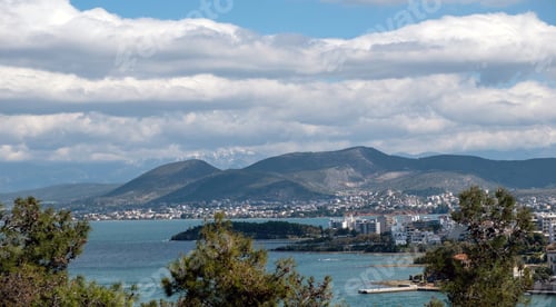 Preview: Greece, view of seafront Chalkida city from Karababa castle, Euripus Strait, cloudy sky background.