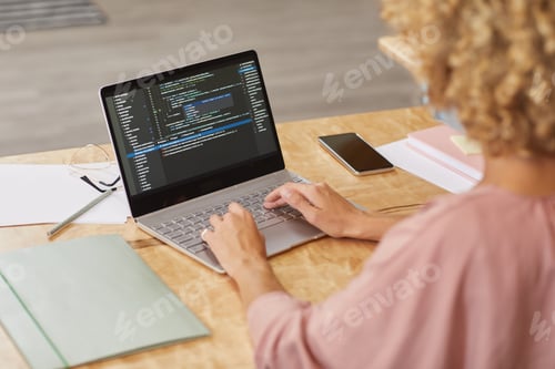 Preview: Programmer working on laptop