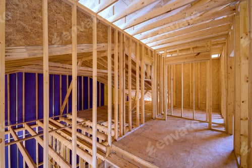 Preview: New unfinished residential home under construction with framing made of wood supporting a beam