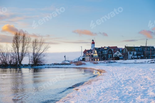 Preview: Urk lighthouse during winter with snow in the Netherlands