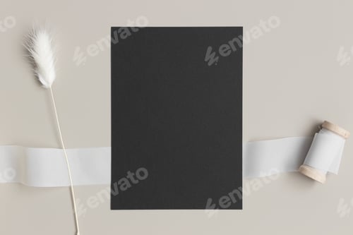 Preview: Black invitation card mockup with a lagurus on a beige table. 5x7 ratio, similar to A6, A5.