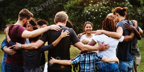 Preview: Group of people huddle together in the park